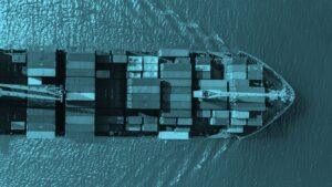 Aerial view of cargo ship over ocean